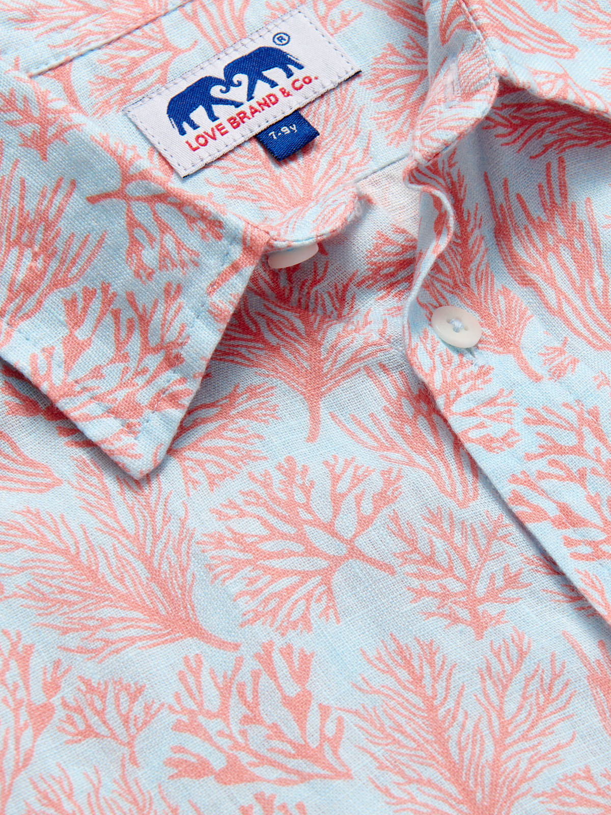 Boys Crazy Coral Abaco Linen Shirt featuring coral reef print in sea blue and coral colors.