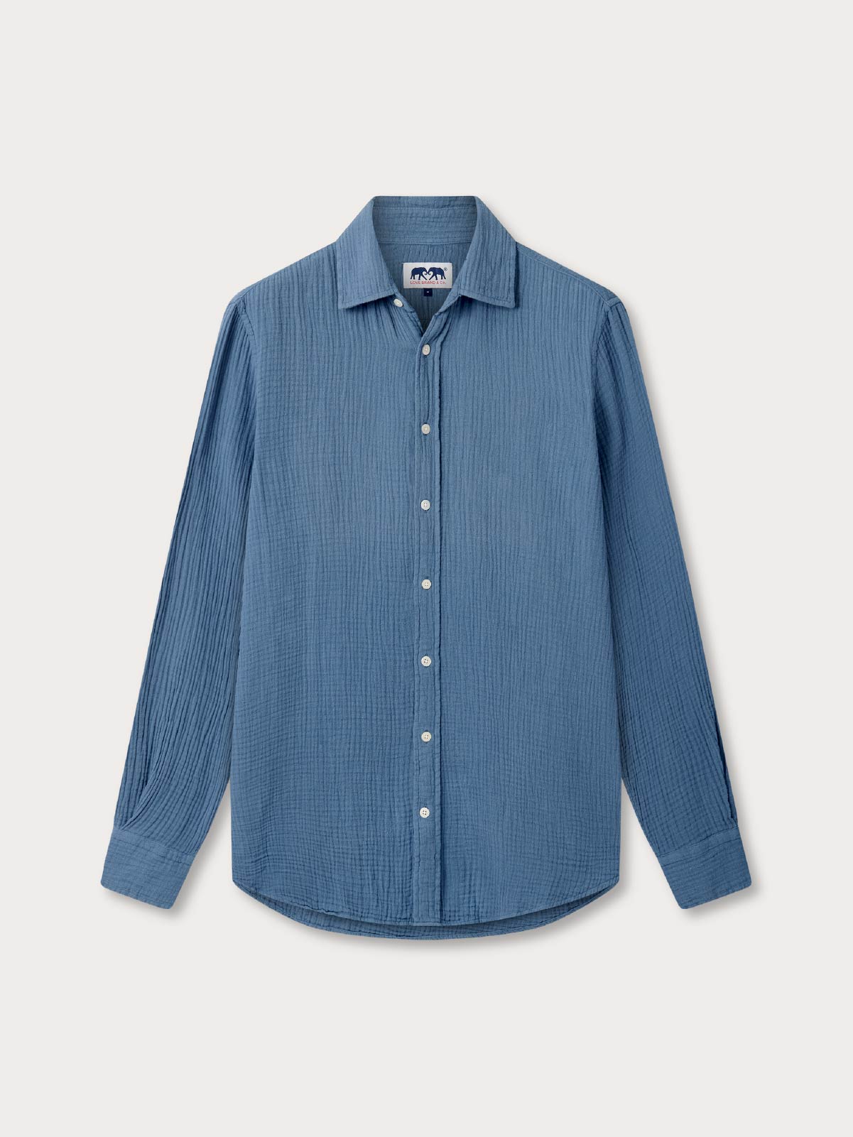 Blue waffle shirt on a light gray background