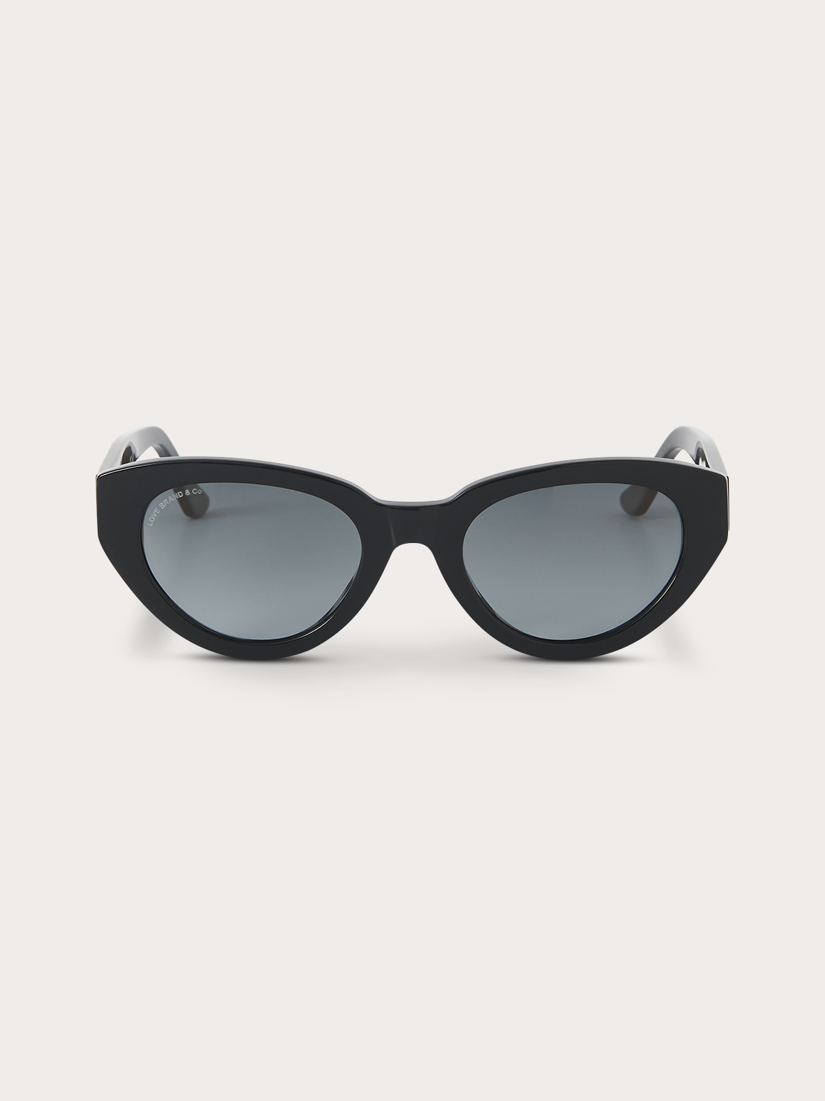Black cat-eye sunglasses with blue frames on a white background