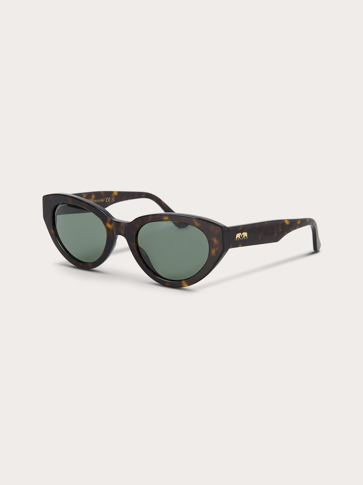 Side view of tortoiseshell sunglasses with green lenses and gold accents