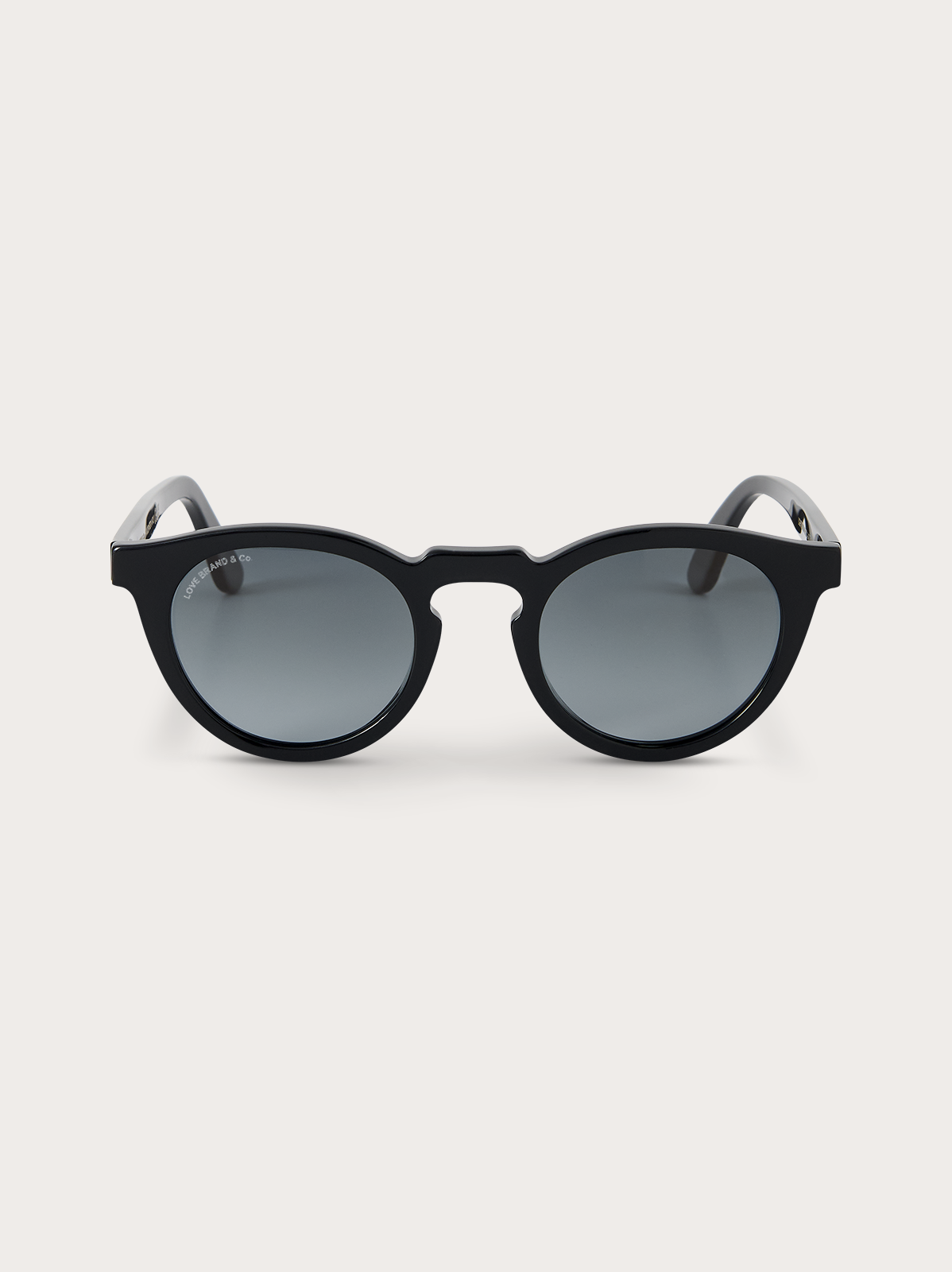 Black sunglasses with blue lenses on a white background