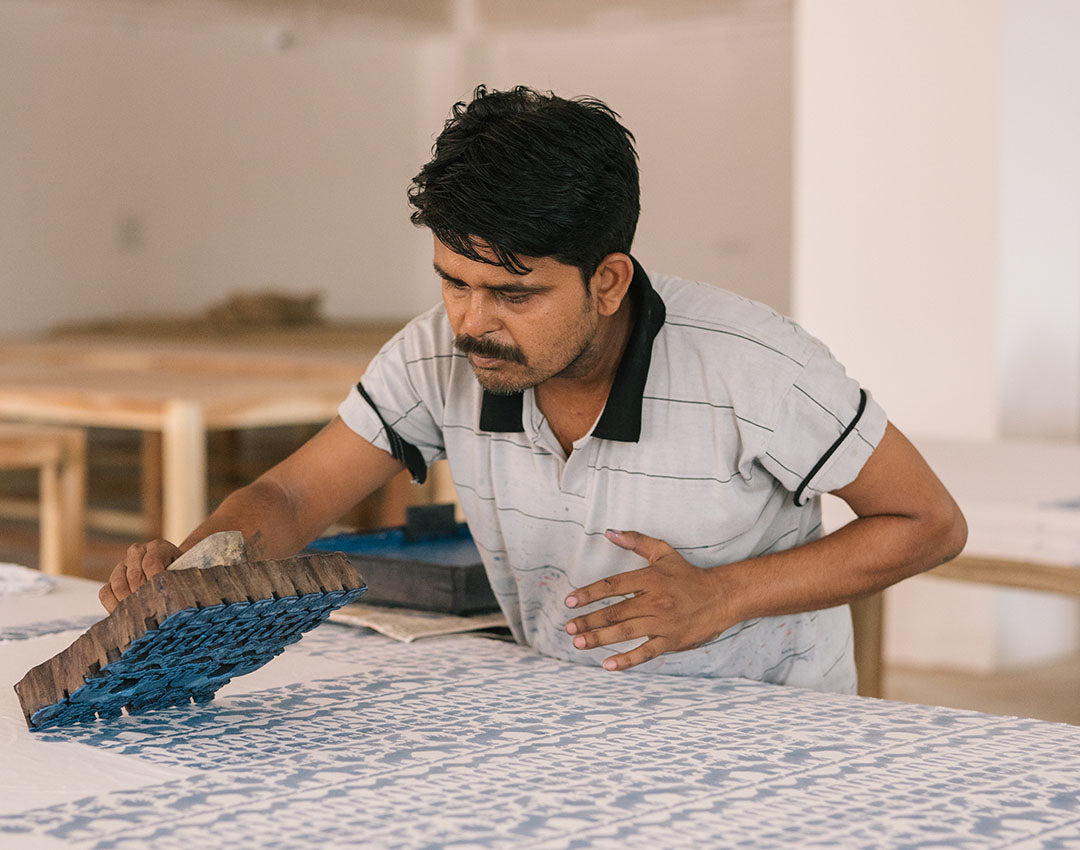 Love Brand artisan using block printing