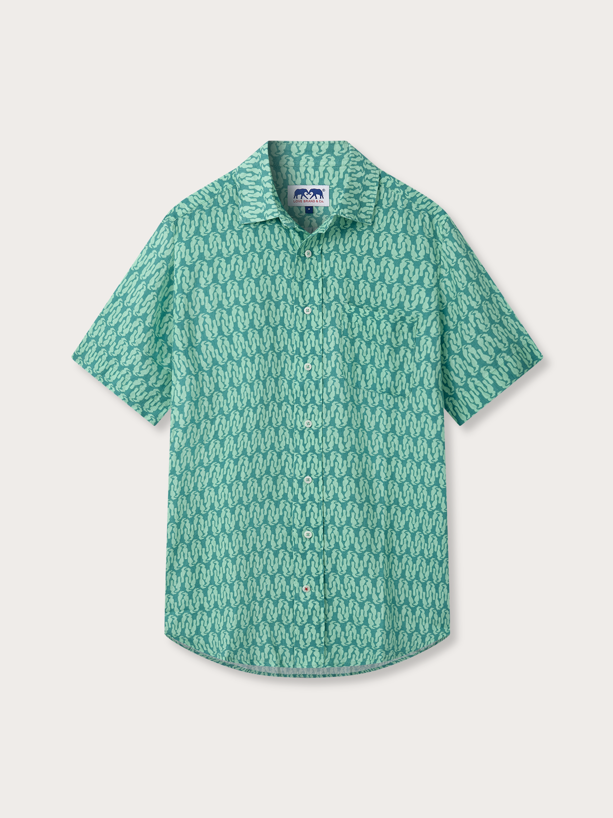 Green patterned shirt on a light gray background