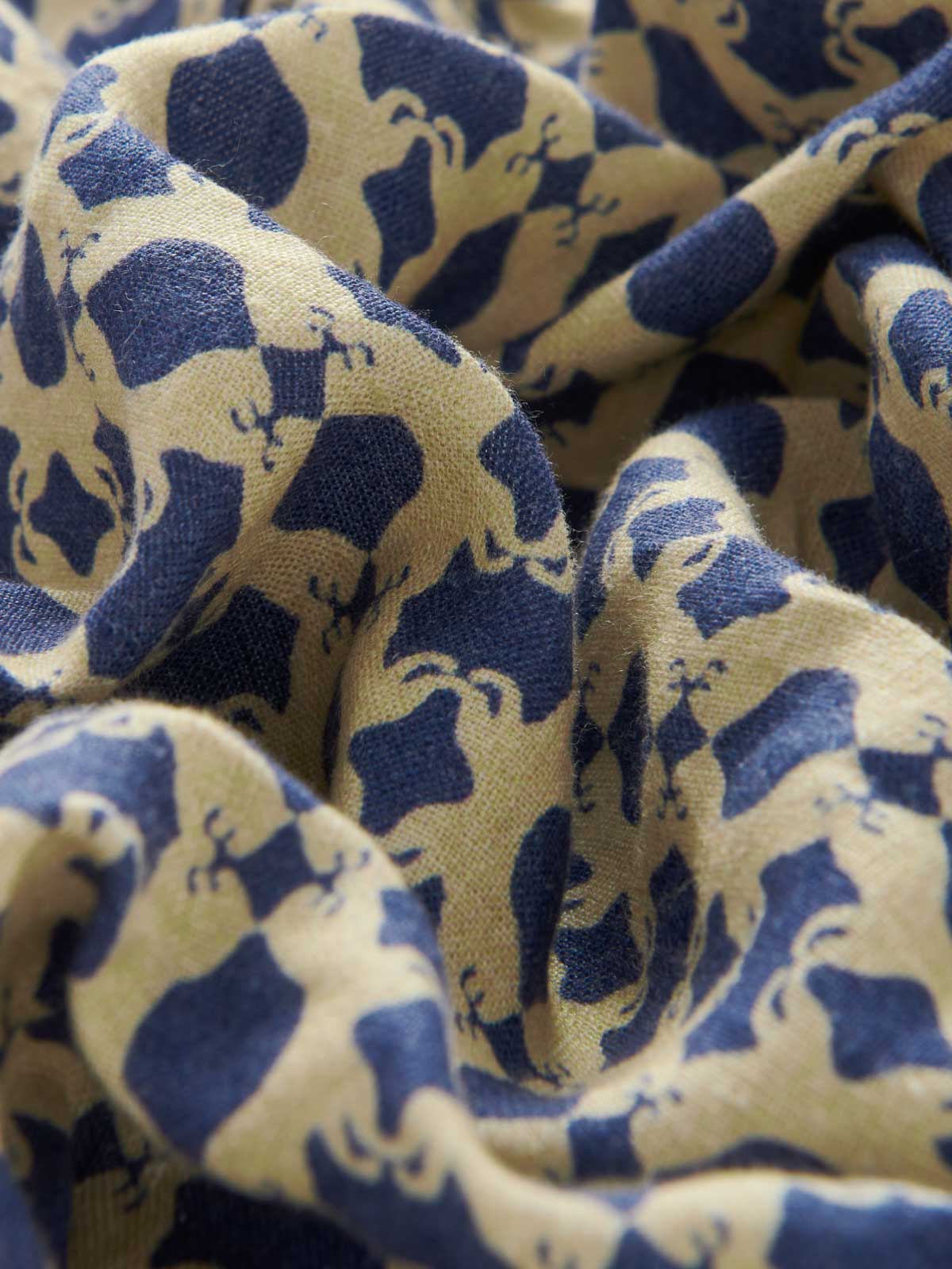 Close-up fabric view of Men's Eye of The Tiger Joulter Linen Shorts. Blue and beige shorts.