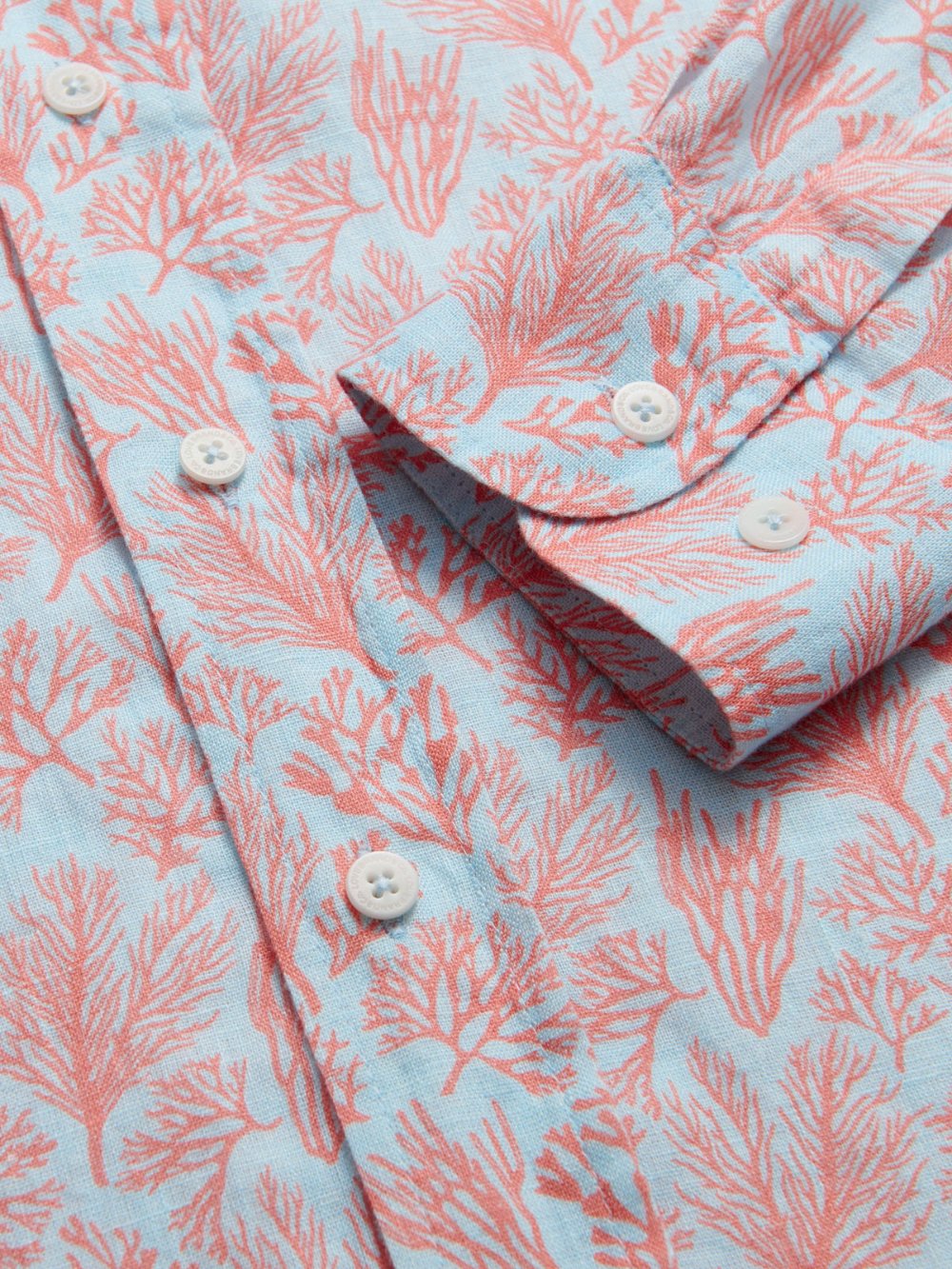 Men's Crazy Coral Abaco Linen Shirt close-up. Detailed view of coral print mens linen shirt.