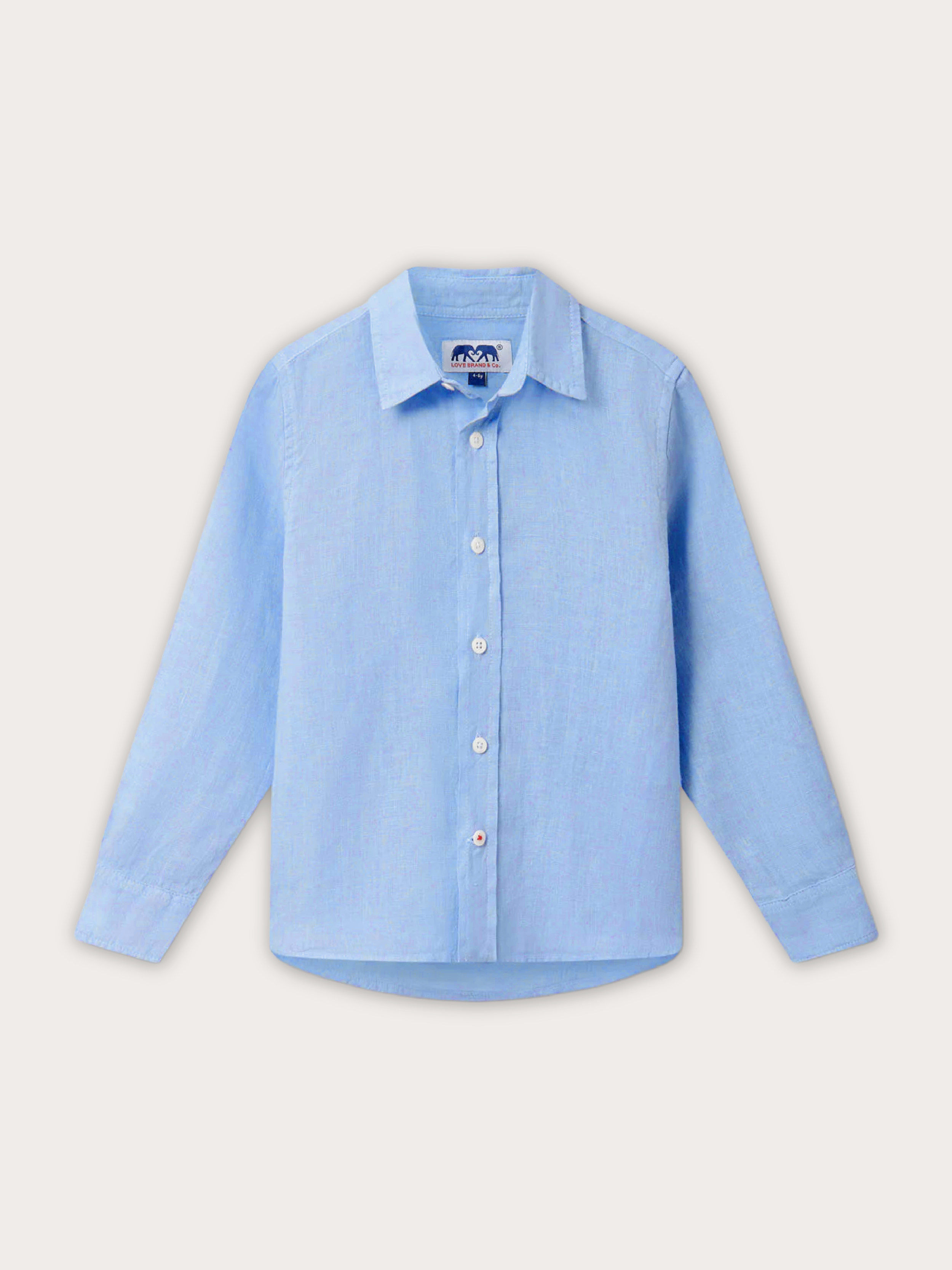Front view of a ight blue linen shirt for kids. Image shows a blue kids shirt with long sleeves and button-up design.