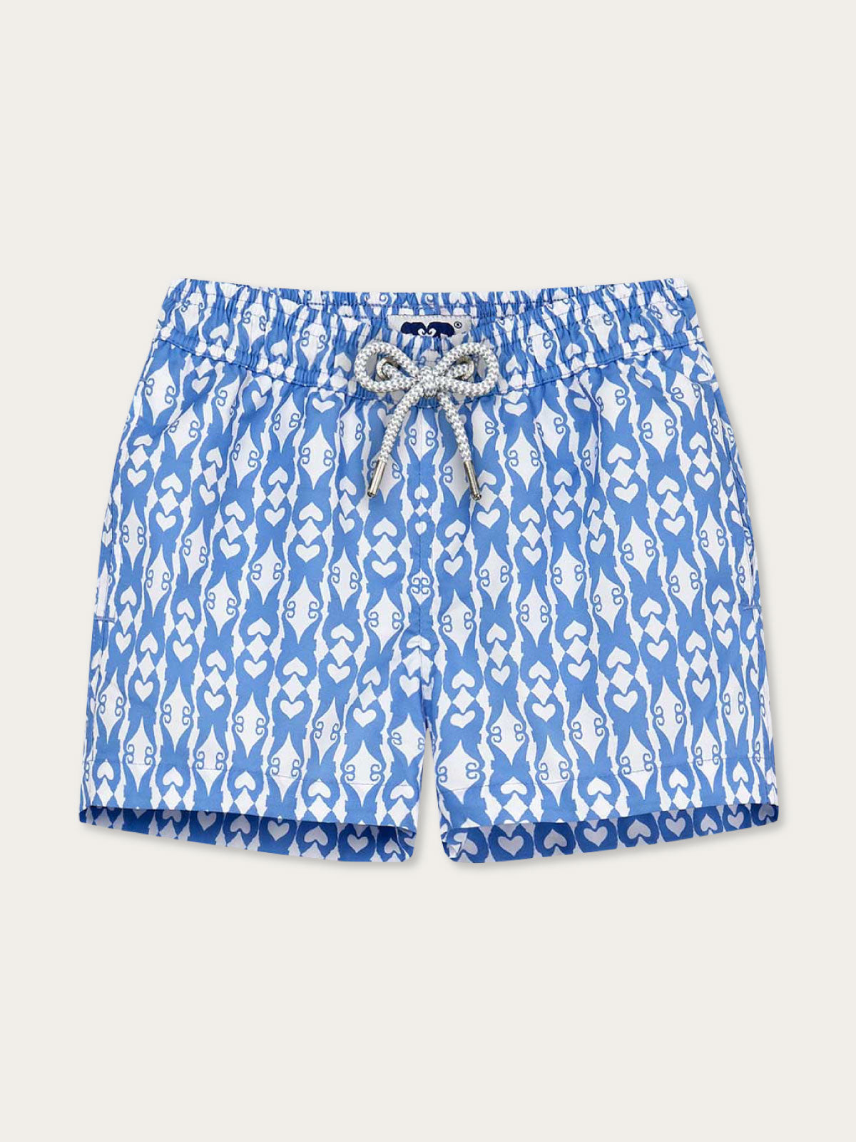 Blue swim shorts with white pattern on a light gray background