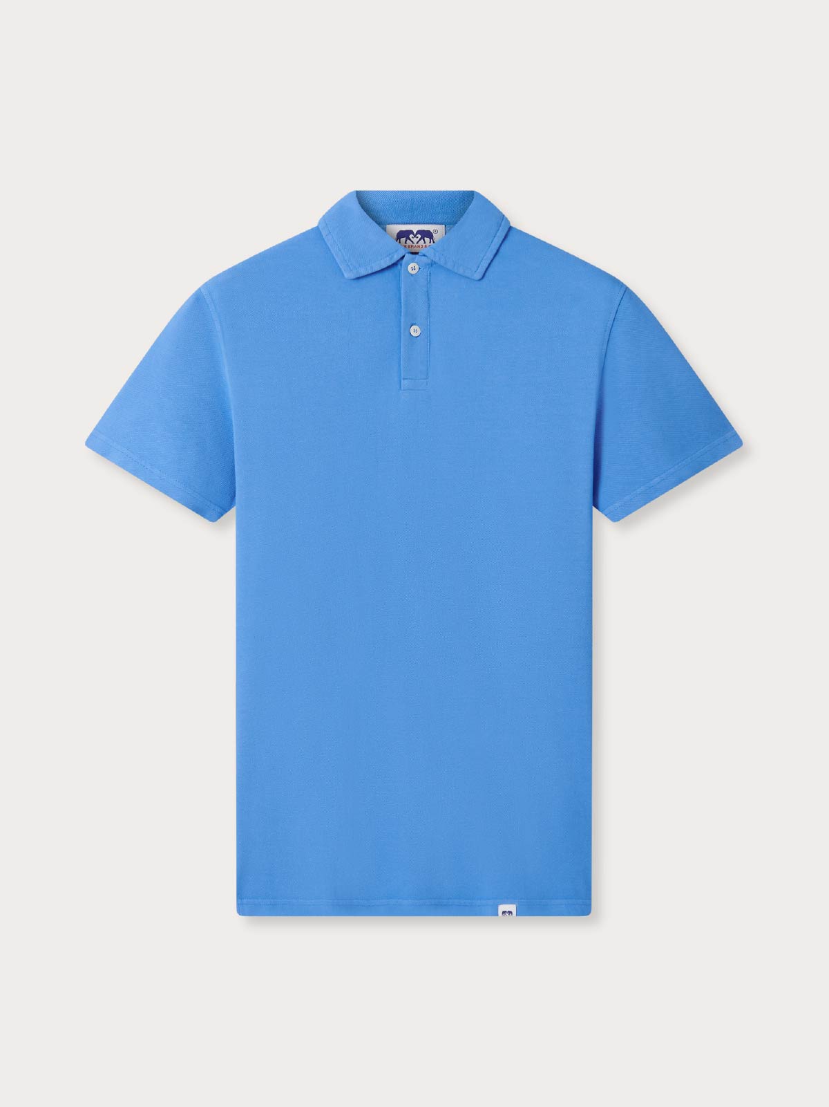 Blue polo shirt on a light gray background