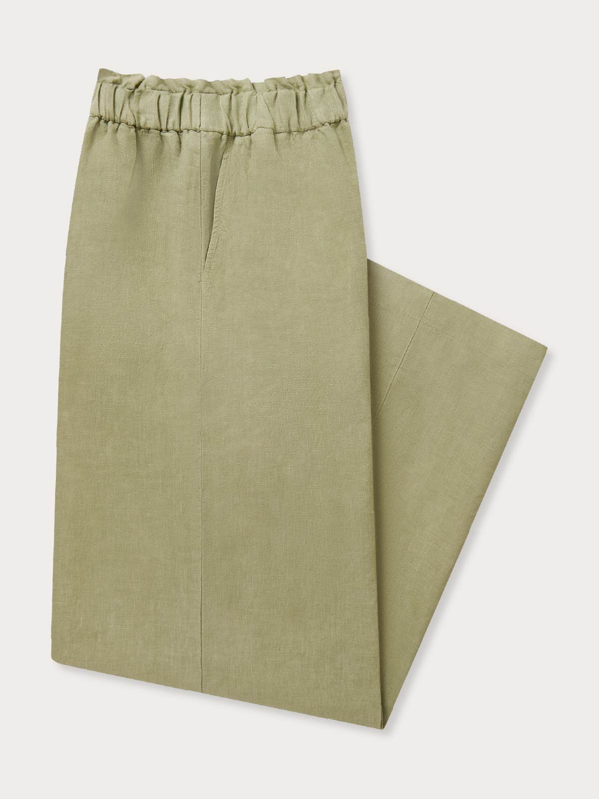 Green linen pants on a white background