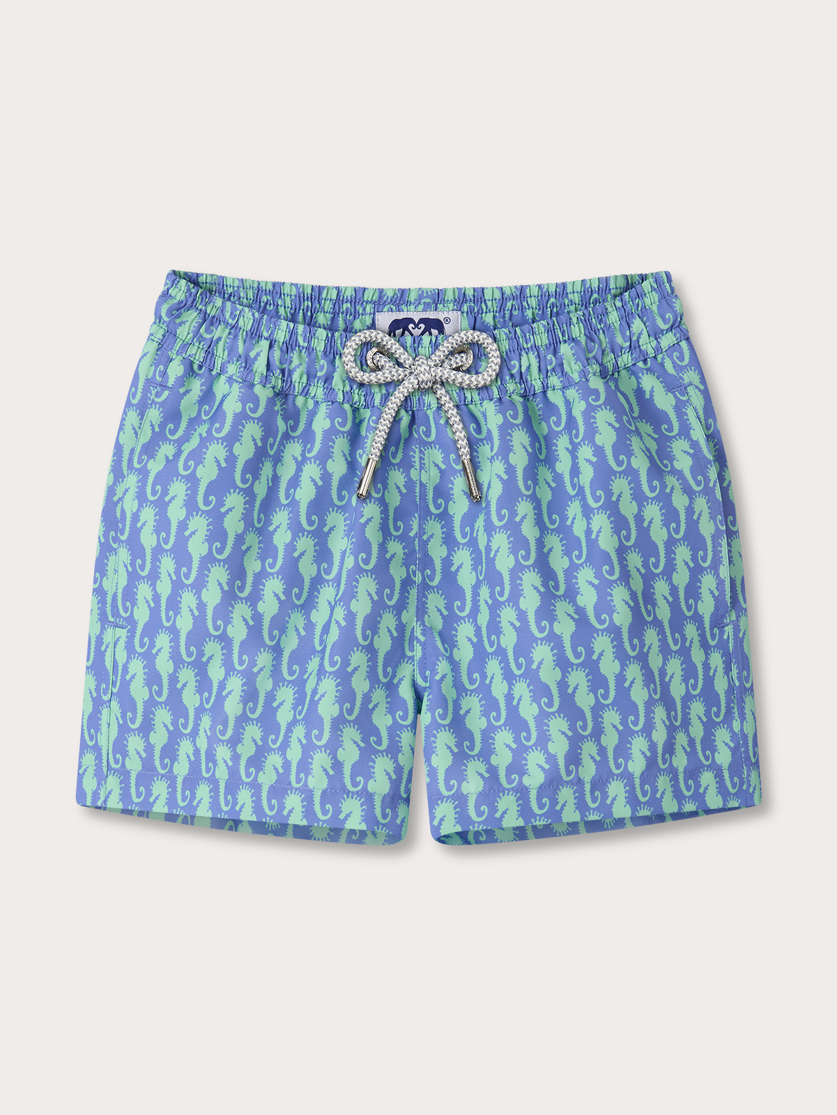 Kids blue swim shorts with seahorse pattern on a white background